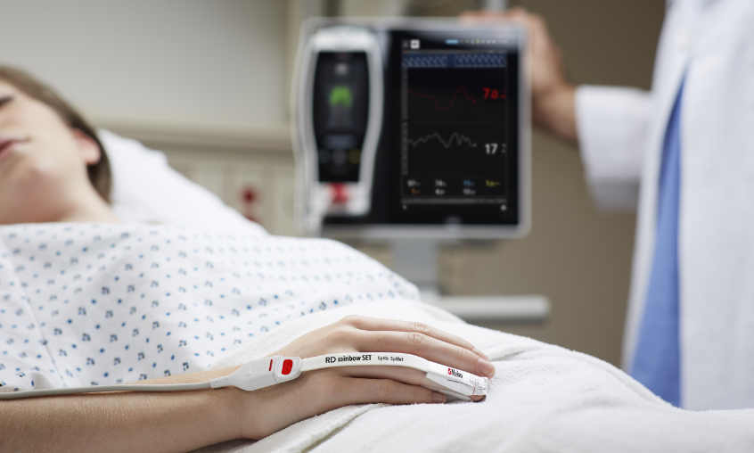 patient laying in hospital bed while wearing RD rainbow SET with sphb and smet measurements 